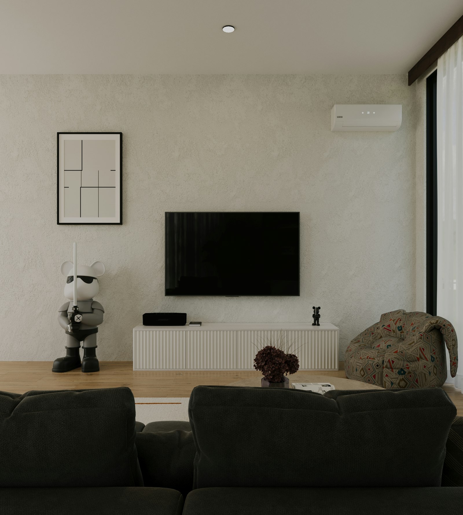 A bright, modern living room with a wall-mounted air conditioning unit
